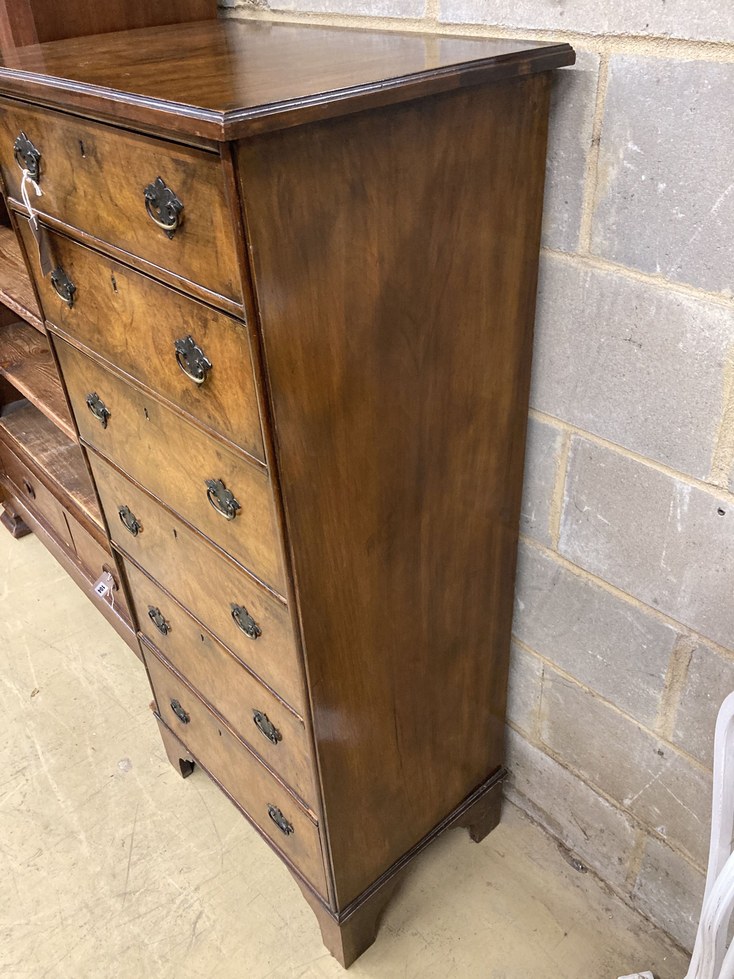 An early 20th century Queen Anne revival walnut narrow six drawer chest, width 61cm, depth 42cm, height 136cm